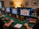 Engaging online gaming experience at UG88 casino, showcasing vibrant games on multiple screens.