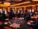Exciting casino atmosphere featuring du88 gaming tables with vibrant poker chips and cards.