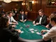 3Bet players strategizing in an upscale poker game with chips stacked high.