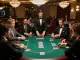 Players strategizing in a vin88 poker game at a luxury casino table, reflecting high stakes.