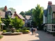 Experience the charm of Claygate with its lush parks and traditional homes in daylight.