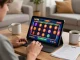 Player enjoying online gaming on GG88 with vibrant slot graphics in a cozy living room