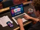 Enjoying a thrilling gaming session on rikvip with a vibrant online casino interface displayed on a laptop.