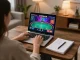 Player enjoying an online poker game on 789win1 with strategic notes in cozy setting