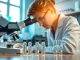 Explore Peptides UK solutions with a focused scientist examining peptide samples in a bright lab.