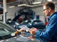 Engaging discussion on a vehicle service contract in a modern auto garage.