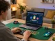 Player engaged in blackjack on laptop at home, showcasing dacsandatphanrang strategy with focused gameplay