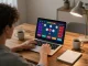 Engaging in tai xiu online gaming experience on a laptop at a cozy home setting.