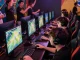 Dynamic gaming arena with players betting on 399W, vibrant screens showcasing live odds, and an energetic crowd.