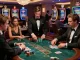 Players engaged in a strategic blackjack game at cm88game casino, showcasing elegance and excitement.