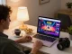 Engaging in online gambling with f168 on a cozy home setup, featuring a live dealer game