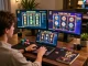 Engaged player enjoying LV88 online casino on a laptop, vibrant gaming setup.