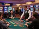 Engaged players enjoying the vibrant 399W casino experience at a roulette table, colorful ambiance and excitement